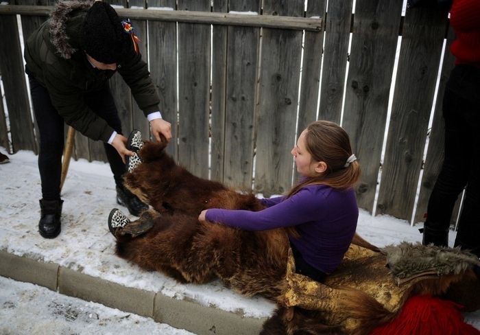 Traditional parade in bearskins of the inhabitants of the Romanian town of Comanesti - Girls, Brown bears, Parade, Romania, Longpost