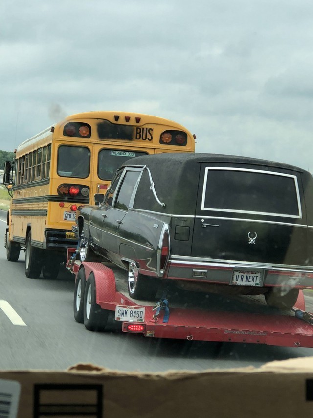 All life in one photo. - School bus, Hearse