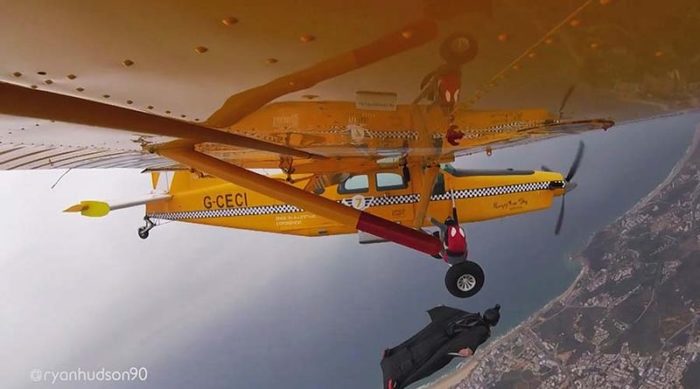 Weird video of a daredevil climbing out of a plane to take a banana from a wingsuiter - The airport, Parachute, Sport, Madness, Youtube, Banana, Video
