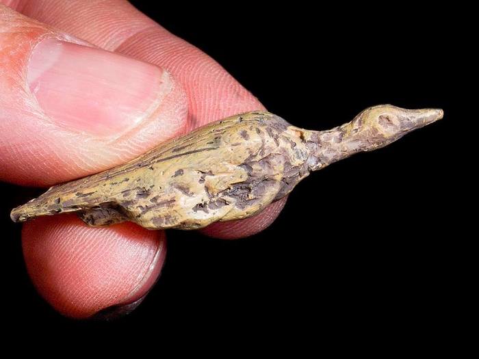 This small carving of a waterfowl was created 35,000 years ago. - Archeology, Art, Primitive art, Mammoth bone, Miniature, Duck, Bone carving