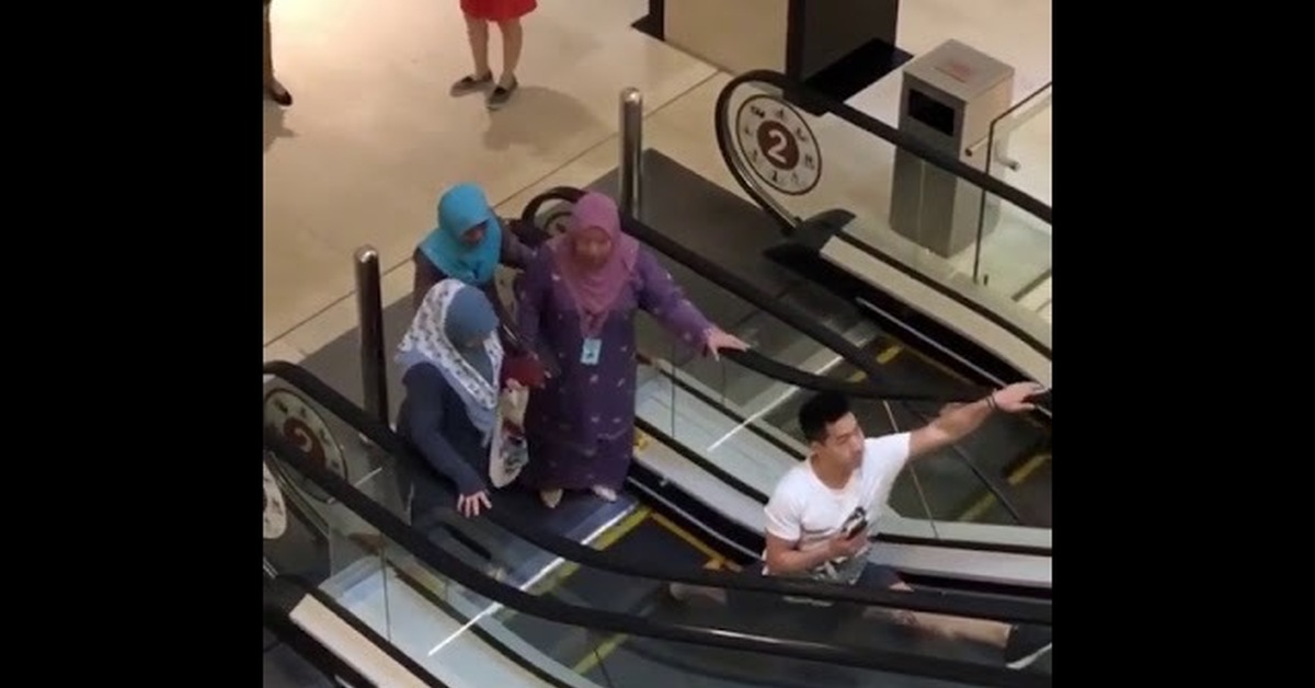 Clown Throwing Pie On Escalator